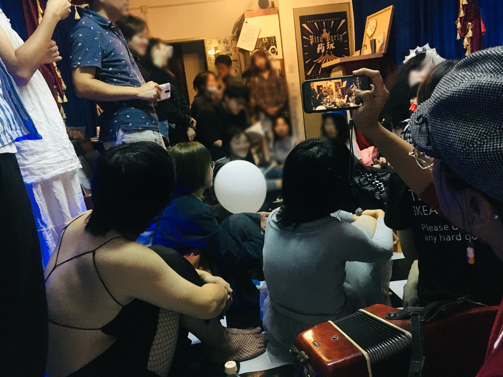 A group of people are sitting in a room.